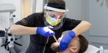 Dr. Natalia Rogulska performing bonding on a patient at Warsaw Dental Center